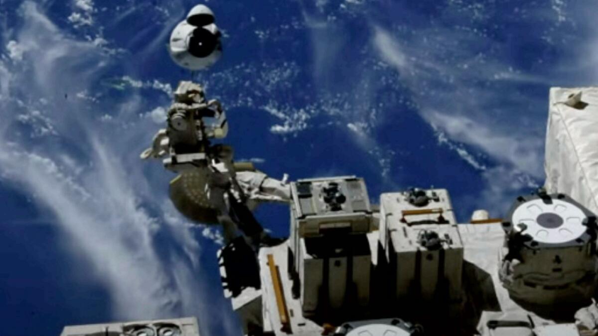 This screengrab taken from the SpaceX live webcast shows a view of the Crew-2  SpaceX Dragon capsule dubbed 'Endeavour', off the side of the International Space Station, as they return to earth. — AFP
