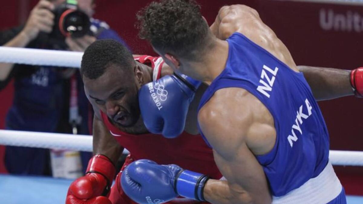 New Zealand's David Nyika (right) punches Youness Baalla of Morocco during their heavyweight boxing match at the Tokyo Olympics. (AP)