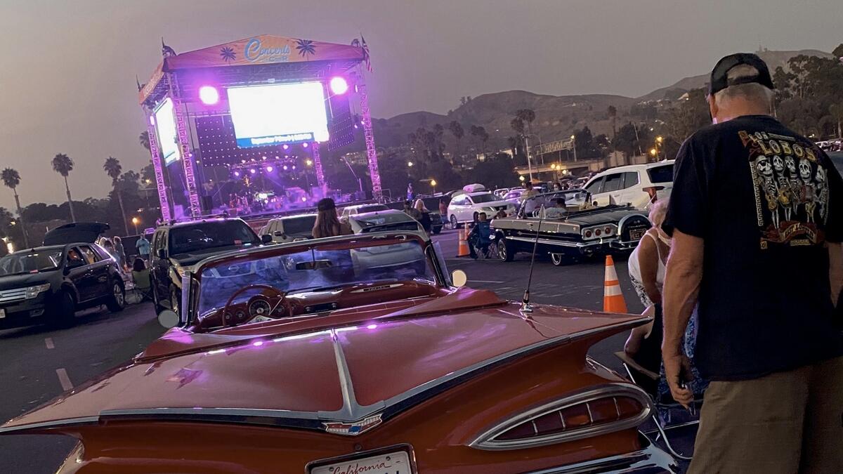 People watch from their cars the band Los Lobos performing during the 'Concert in your cars' series in Ventura, California. Photo: AFP