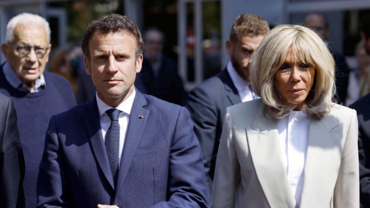 Emmanuel Macron and first lady Brigitte Macron. — AFP