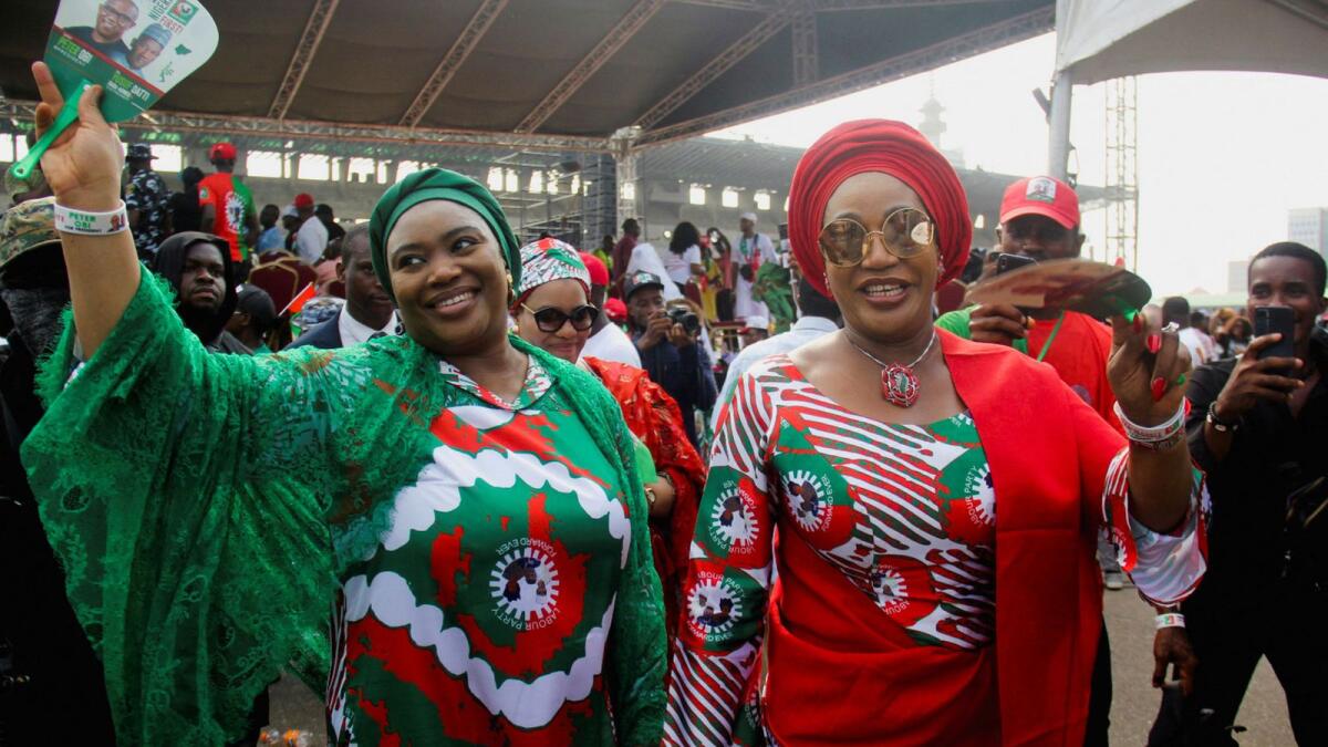 Margaret Obi, wife of Presidential candidate Peter Obi of Labour Party (LP), and Hajiya Aisha Baba-Ahmed, wife of Vice Presidential candidate Yusuf Datti Baba-Ahmed, wear traditional attires with LP branding during a campaign rally in Lagos, Nigeria February 11, 2023. REUTERS/Vining Ogu