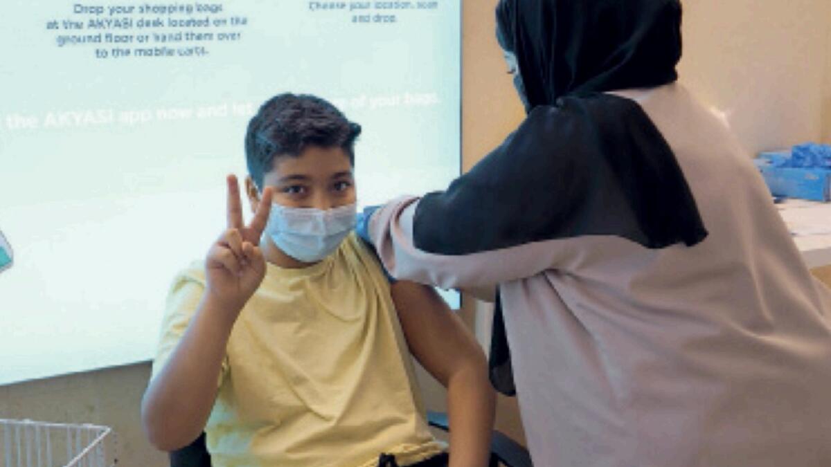 A student receives vaccination in Dubai. — Supplied photo