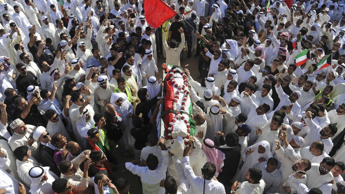 Thousands of mourners from across the country take part in a mass funeral procession for 27 people killed in a suicide bombing, at the Grand Mosque in Kuwait City on June 27, 2015.  — AP file