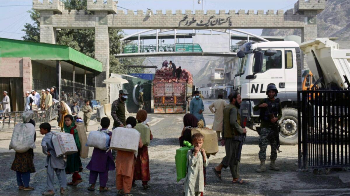 Afghan people prepare to cross over to Pakistan through the Afghanistan-Pakistan joint border crossing in Torkham of Nangarhar province. — AFP