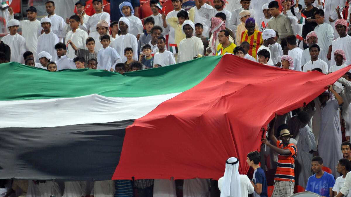 Al Jazira Fans during the Arabian Gulf League match.-Photo By Nezar Balout/Khaleej Times