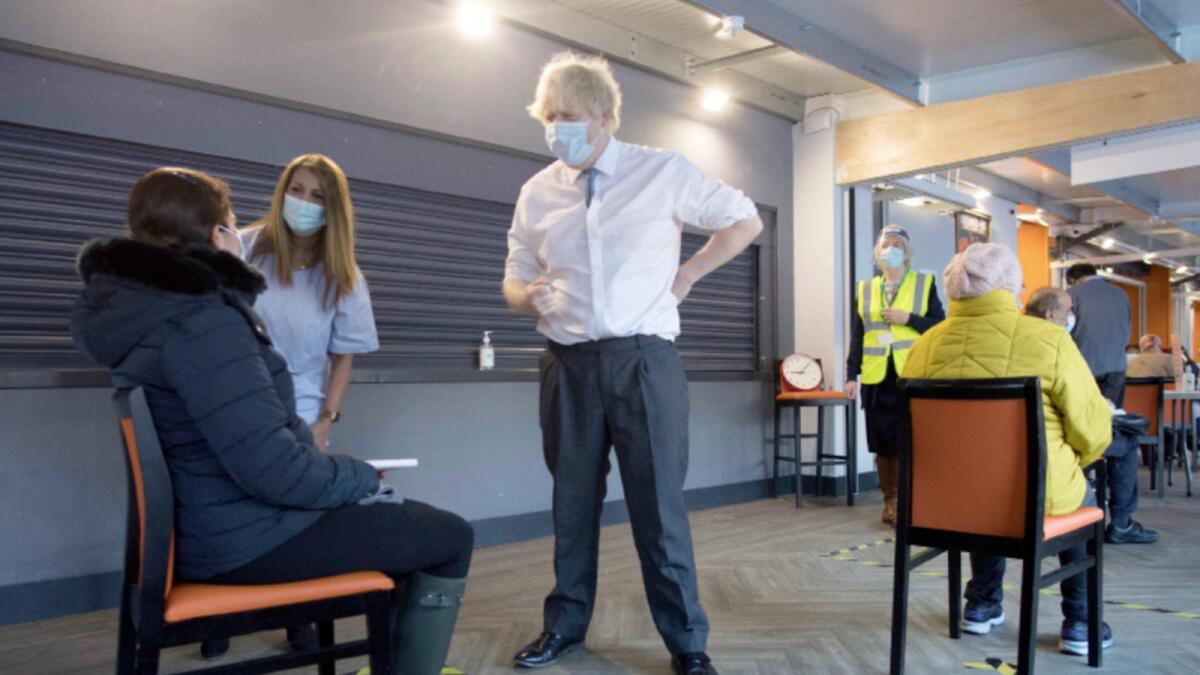 British Prime Minister Boris Johnson meets staff and patients at Barnet FC's ground, The Hive, which is being used as a coronavirus vaccination centre, in north London. — Reuters