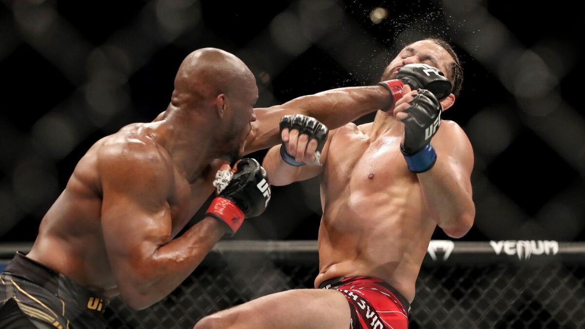 Kamaru Usman of Nigeria punches Jorge Masvidal of the United States during the Welterweight Title bout of UFC 261 at VyStar Veterans Memorial Arena.— AFP