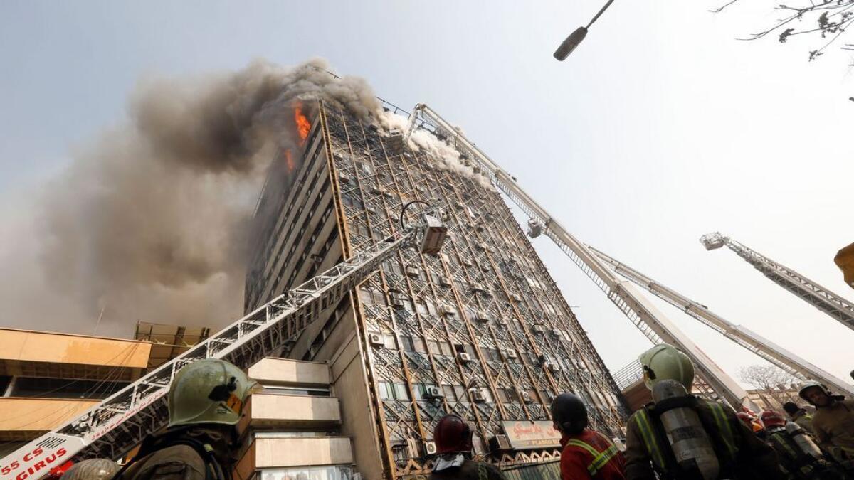 High-rise tower on fire in Iranian capital collapses