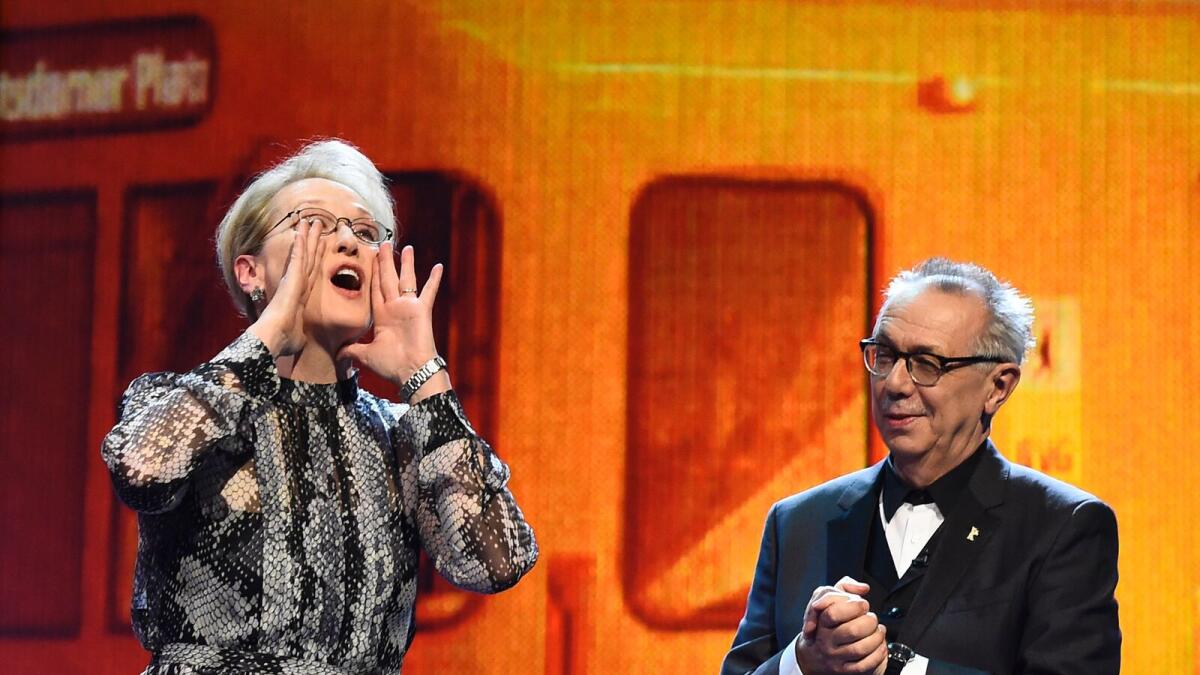 TOPSHOT - US actress and jury president Meryl Streep (L) and festival director Dieter Kosslick take the stage prior to  the film 'Hail, Caesar!' screening as opening film of the 66th Berlinale Film Festival in Berlin on February 11, 2016.  Eighteen pictur