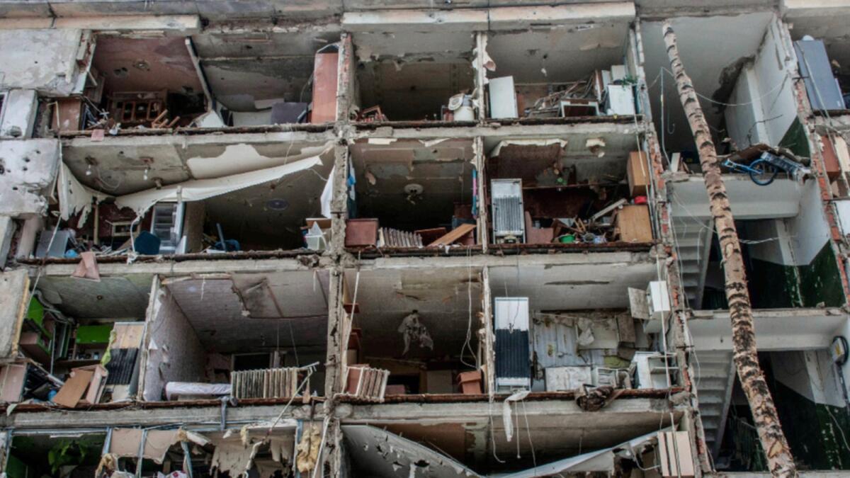 A view of destroyed apartments damaged by shelling, in Kharkiv. — AP