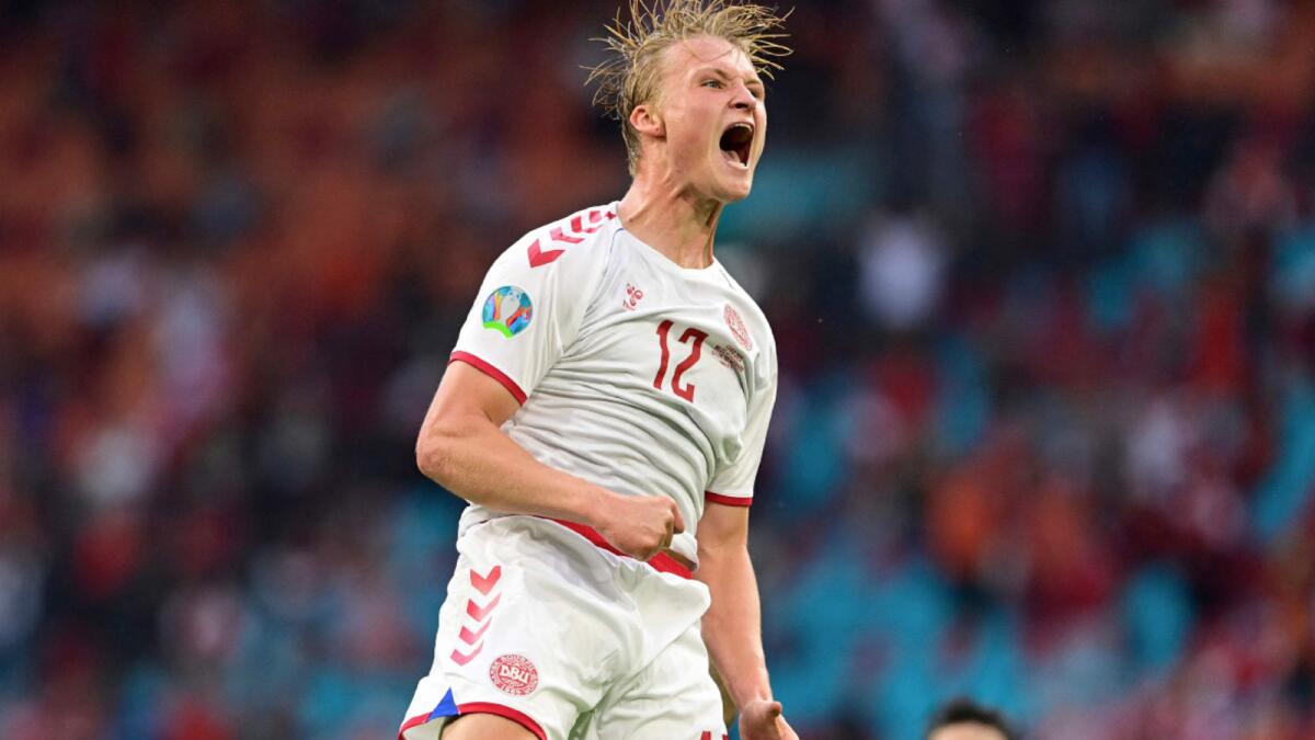Denmark's forward Kasper Dolberg celebrates scoring their second goal against Wales. (AFP)