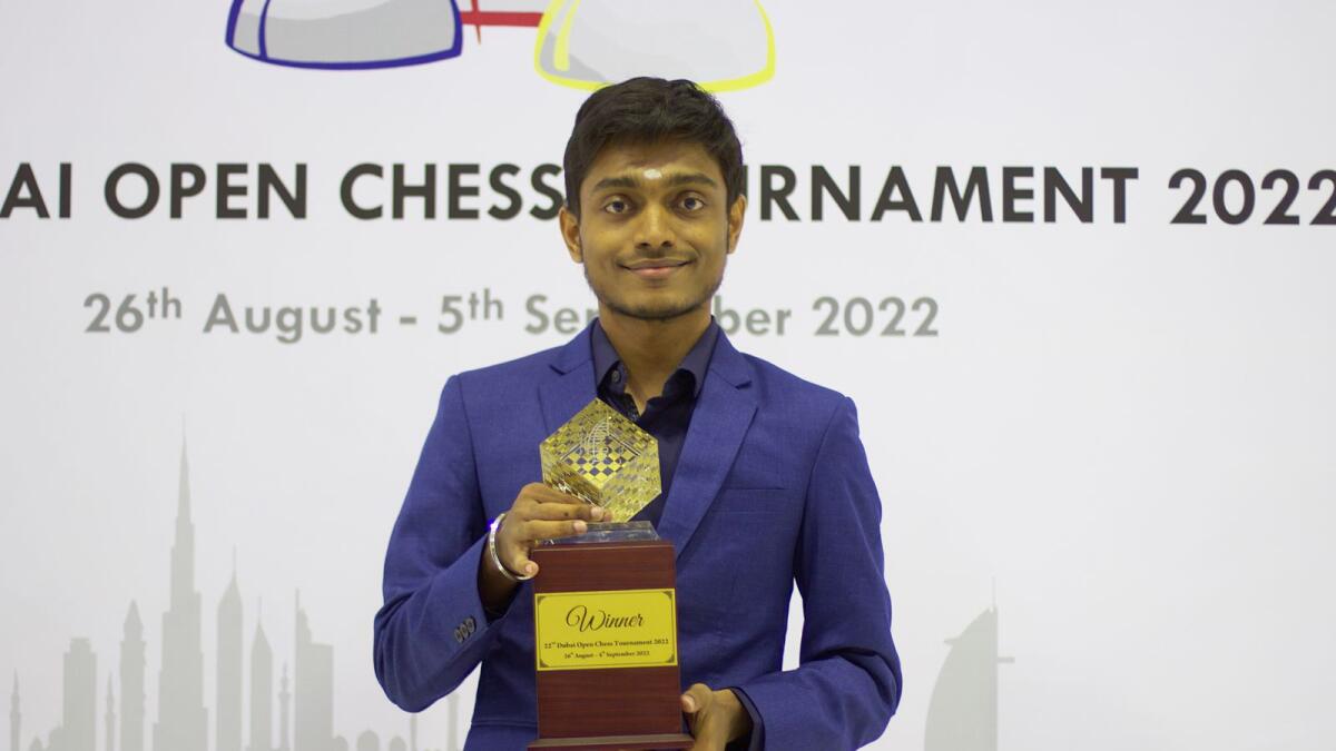 GM Aravindh Chithambaram holds his championship trophy. — Jobannie Tabada