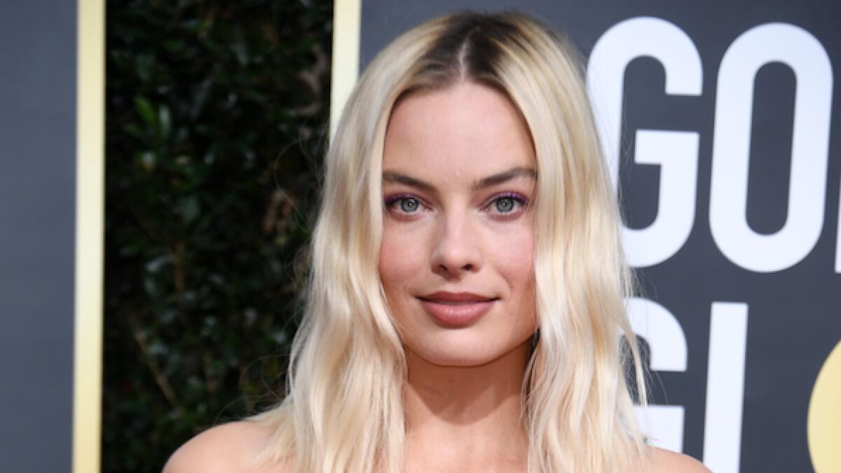 Margot Robbie looked chic in a Chanel Haute Couture bejewelled gown