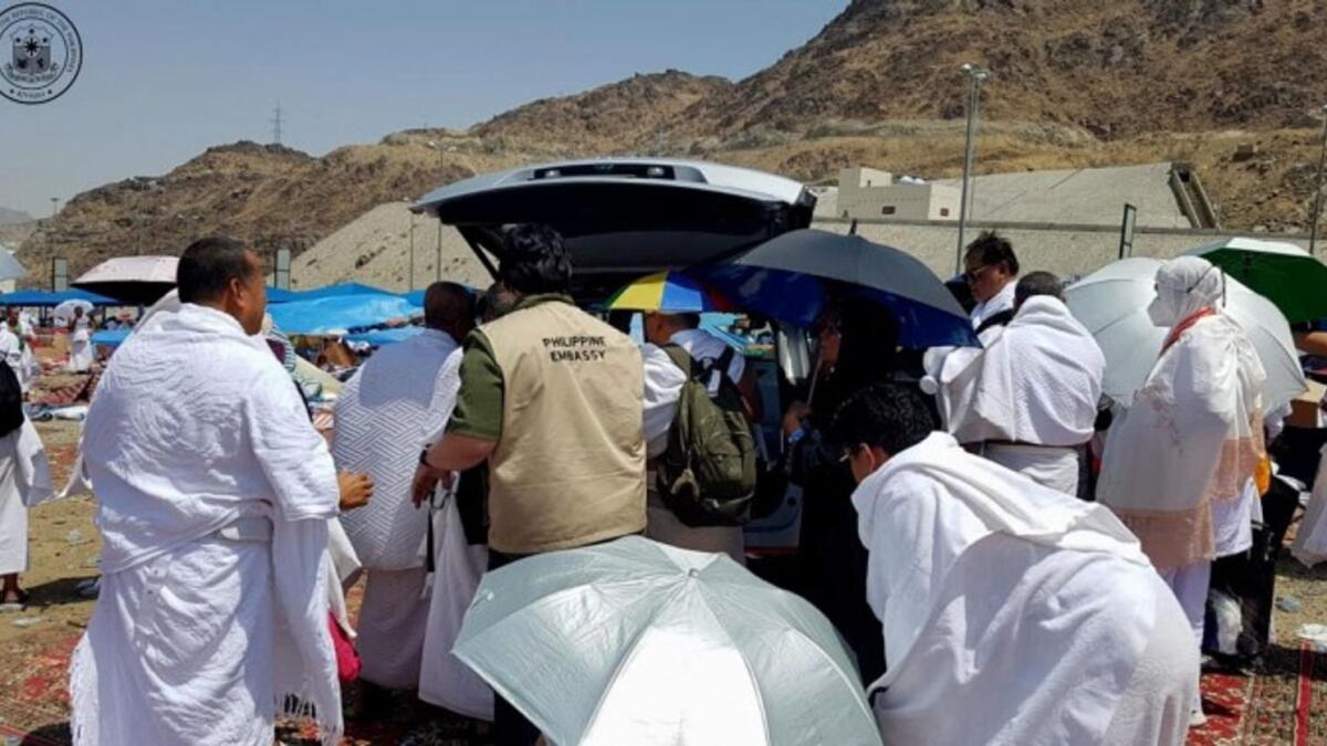 A team from the Philippine Embassy in Riyadh assists distressed Filipino Hajj pilgrims in Saudi Arabia on June 28. Some of the pilgrims were endorsed for medical care and had been discharged. — Photo courtesy: Philippine Embassy in Riyadh