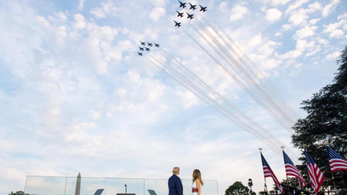 US President Donald Trump and First Lady Melania Trump watch as the US Navy Blue Angels and US Air Force Thunderbirds fly over as they host the 2020 'Salute to America' event in honor of Independence Day on the South Lawn of the White House in Washington, DC on July 4, 2020. Photo: AFP