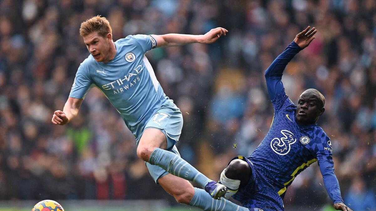 Manchester City's Kevin De Bruyne (left) avoids a challenge by Chelsea's N'Golo Kante at the Etihad Stadium in Manchester on Saturday. — AFP