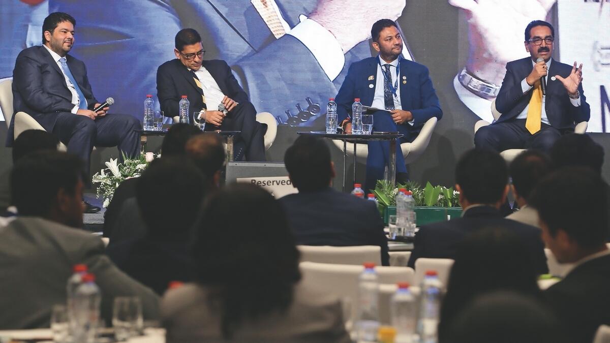 Y. Sudhir Shetty, group president, UAE Exchange; Padmanabha; Samir Chaturvedi; and Mayur Batra during a panel discussion at the event.