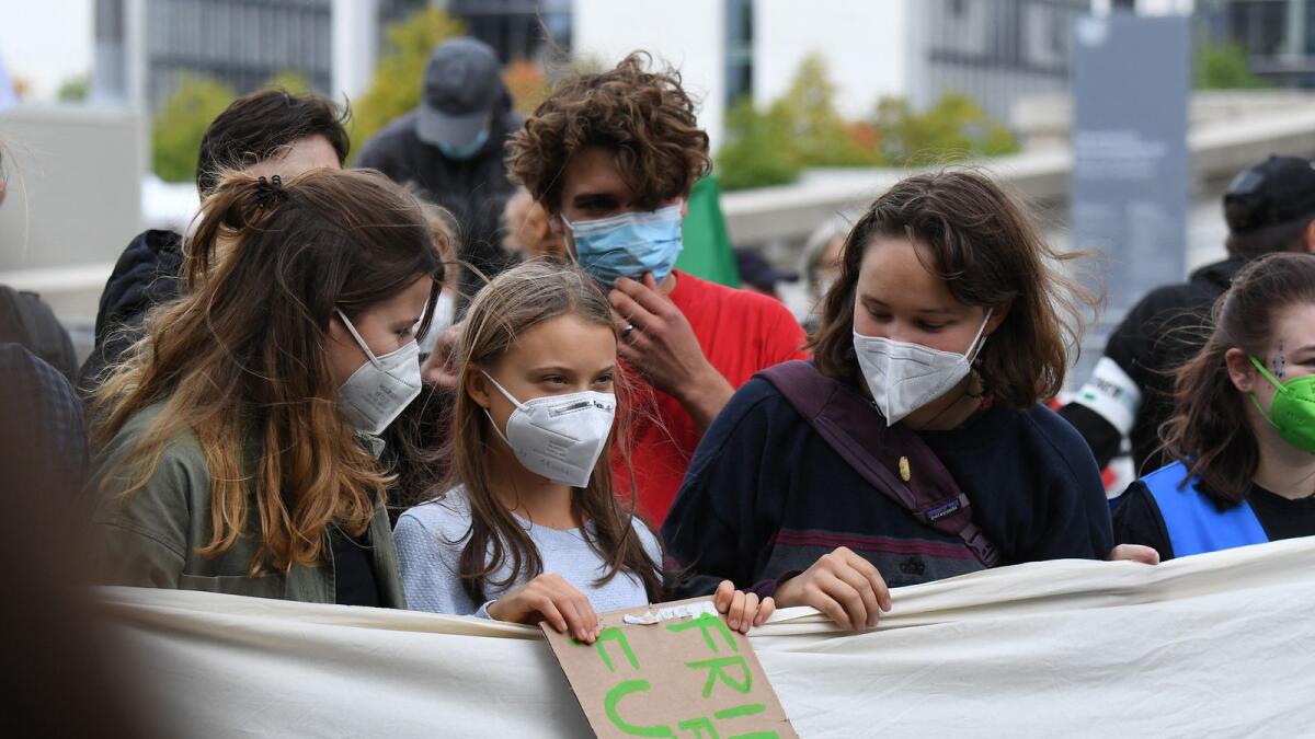 Climate activist Greta Thunberg (centre) takes part in the Future global climate strike in Berlin. Photo: AFP