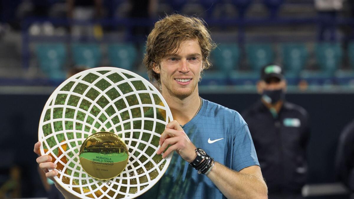 Andrey Rublev of Russia poses with the trophy. (AFP)