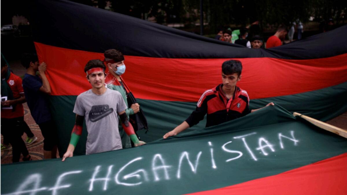 Afghan men demonstrate against the Taliban takeover of Afghanistan, in Sofia, Bulgaria. — Reuters