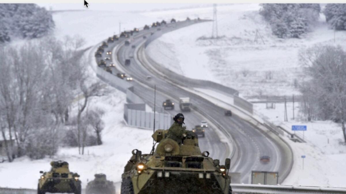 A convoy of Russian armoured vehicles moves along a highway in Crimea. — AP