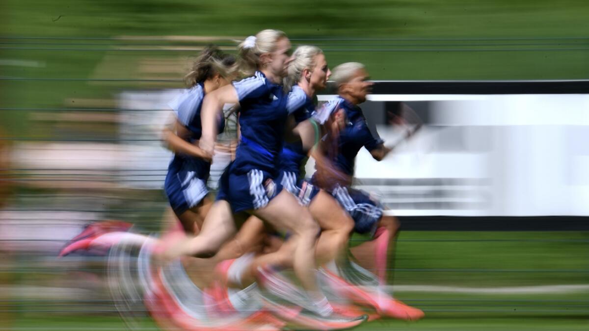 Lyon’s women players sprint during a training session at the Cantona stadium in Tignes, French Alps, part of the team football training camp. Photo: AFP