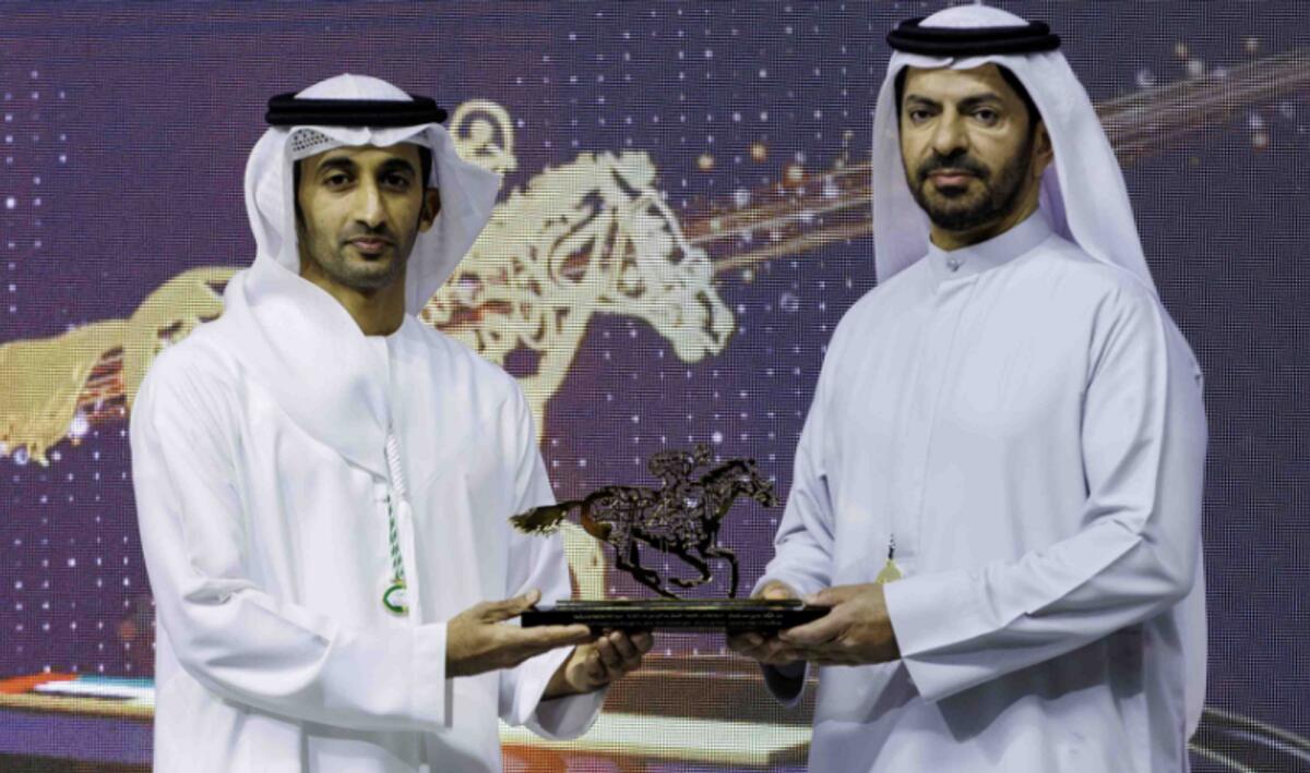 Sheikh Rashid Dalmook Al Maktoum, Chairman of Dubai Racing Club,presents Saeed bin Suroor with the His Highness Sheikh Mohammed bin Rashid Al Maktoum Horse Racing Excellence Award. - Dubai Racing Club