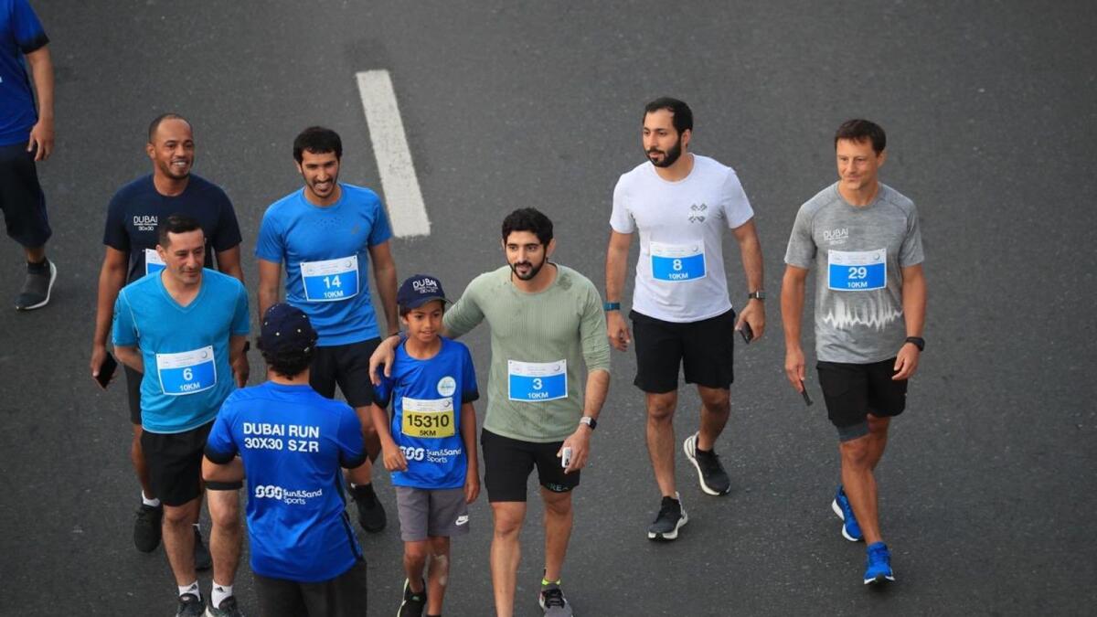 Sheikh Hamdan bin Mohammed led the first Dubai Run on Sheikh Zayed Road in 2019. File photos courtesy: Government of Dubai Media Office/Twitter