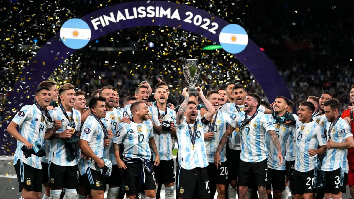 Argentina's Lionel Messi holds the trophy as he celebrates with his teammates after winning the Finalissima against Italy at Wembley Stadium in London on Wednesday. — AP