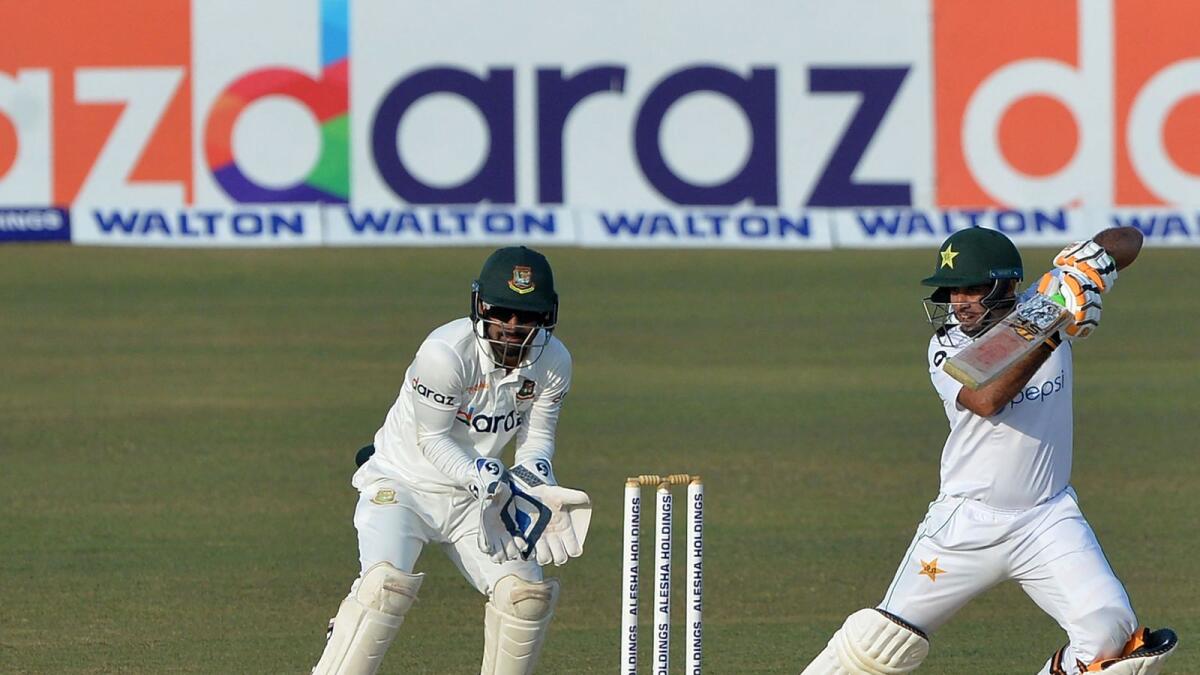 Pakistan's Abid Ali (right) plays a shot as Bangladesh wicketkeeper Liton Das looks on. (AFP)