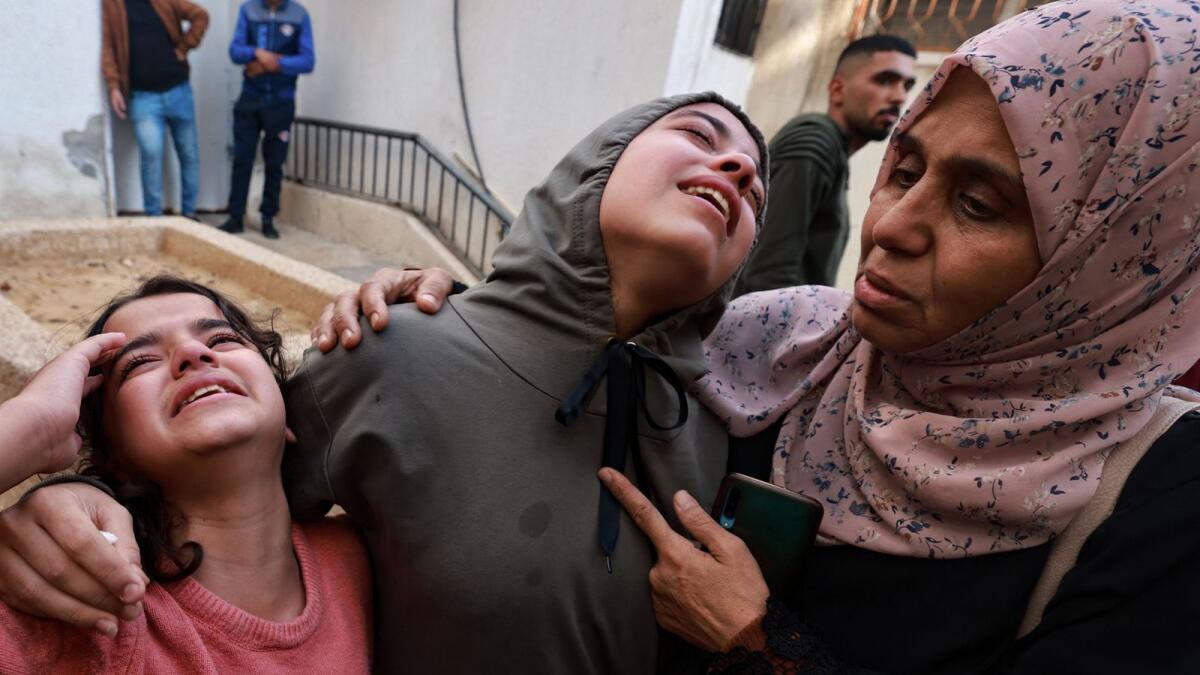 Family members mourn a baby girl killed in an Israeli strike in Rafah in the southern Gaza Strip, in the courtyard of  Al Najjar hospital on December 1. — Photo: AFP