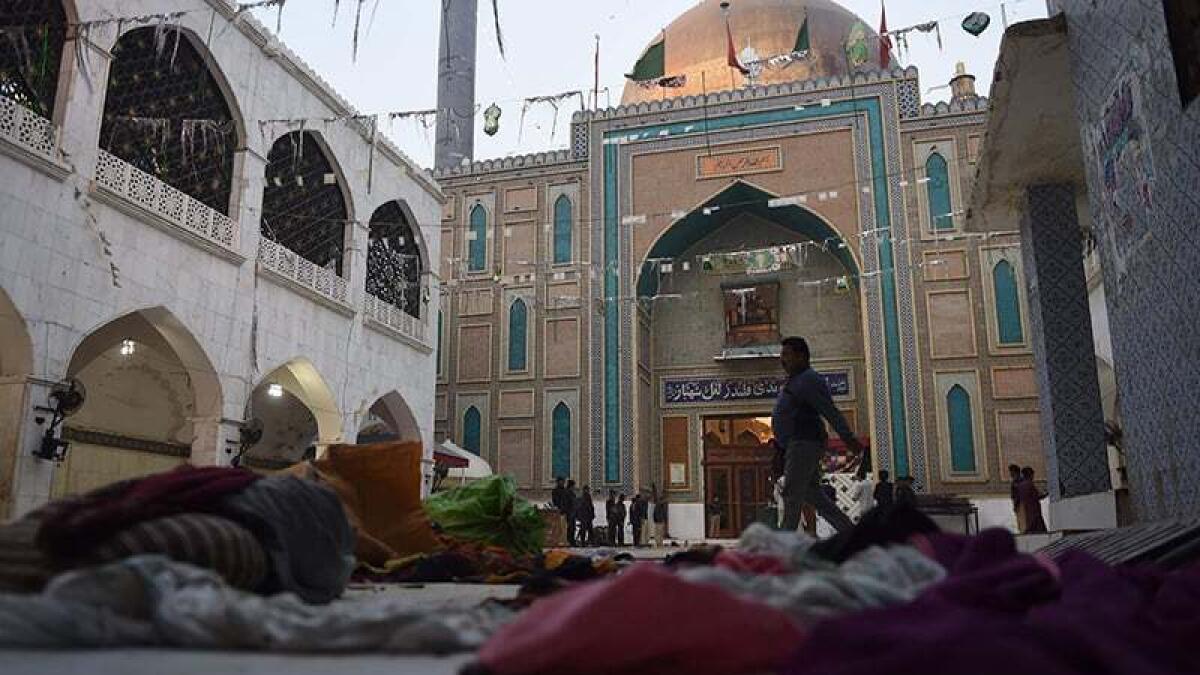 Over 25 killed in crackdown after blasts in Pakistan shrine