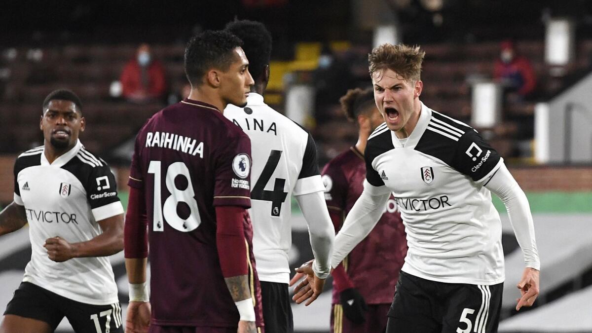 Fulham's Joachim Andersen (right) celebrates after scoring a goal against Fulham during the English Premier League match. — AP