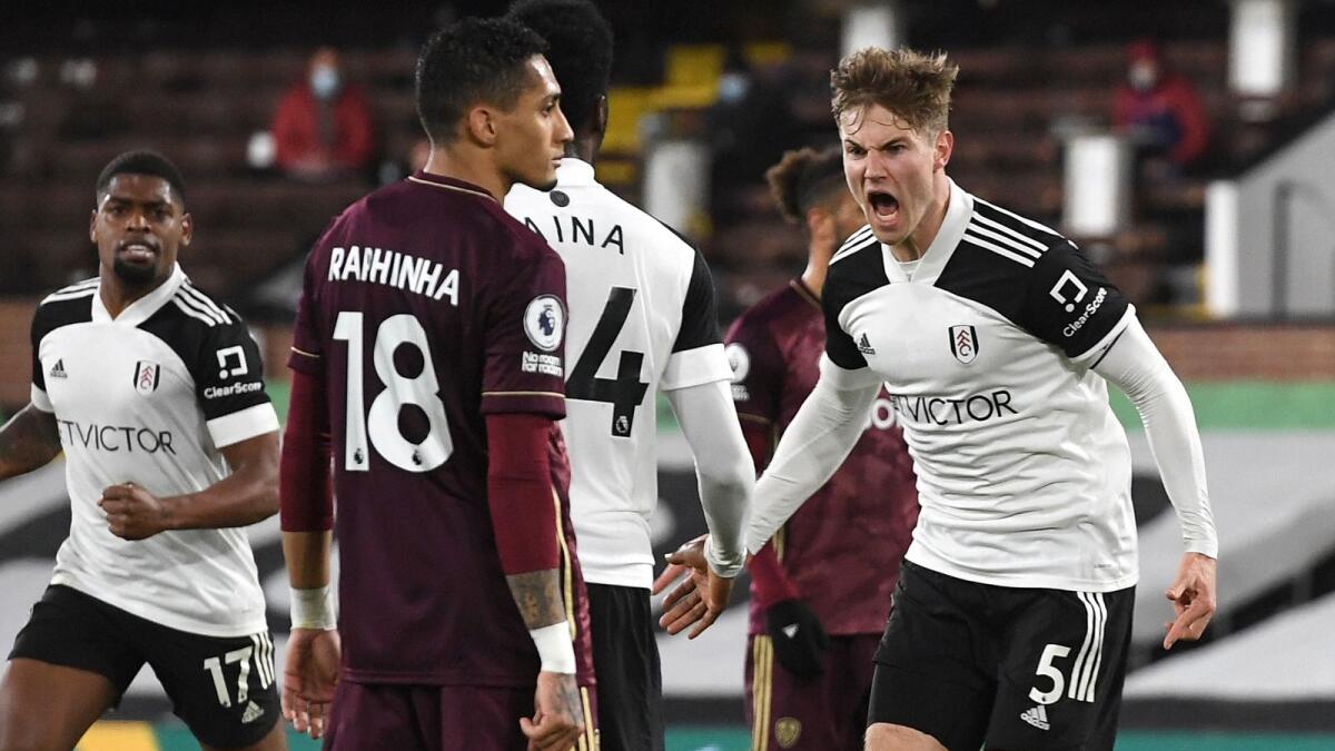 Fulham's Joachim Andersen (right) celebrates after scoring a goal against Fulham during the English Premier League match. — AP
