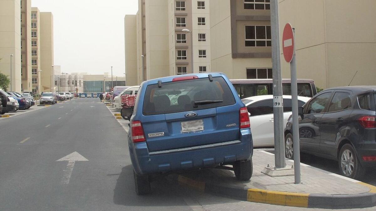 HOW NOT TO PARK ... These photos taken in different areas of Dubai and Sharjah show cars parked illegally. - Photos by Juidin Bernarrd