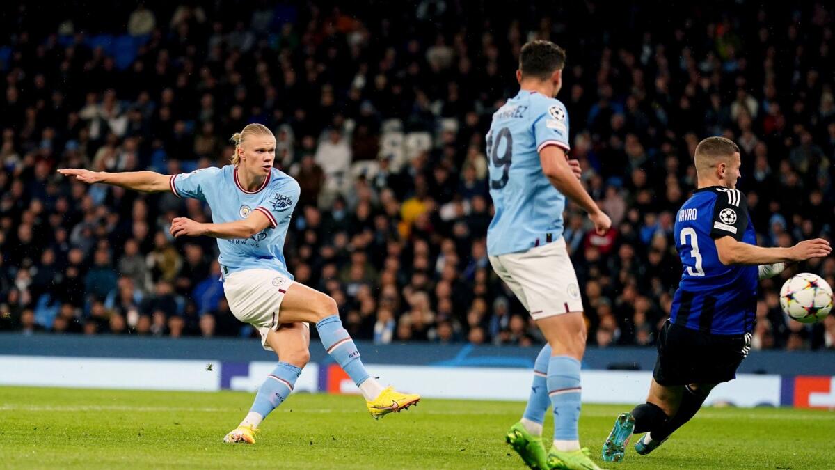 Manchester City's Erling Haaland (left) scores during the Champions League match against FC Copenhagen at the Etihad Stadium in Manchester on Wednesday. — AP