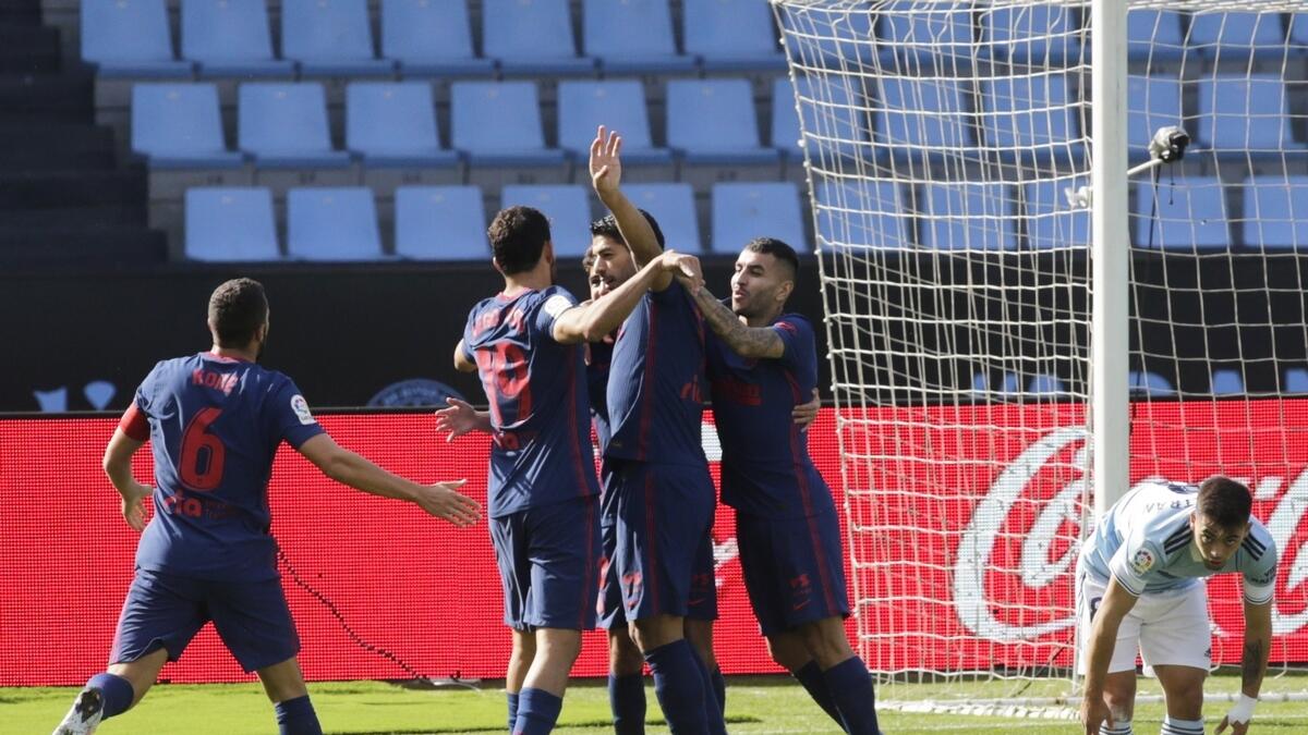 Atletico Madrid's Luis Suarez celebrates a goal with his teamamtes