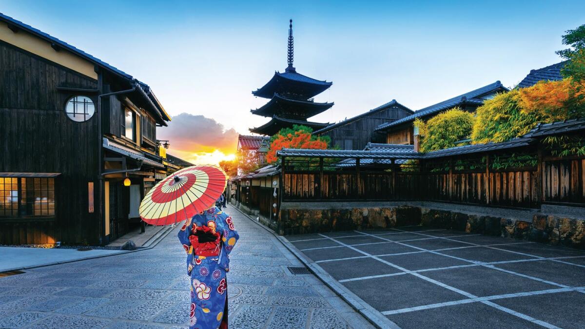 Asian woman wearing japanese traditional kimono at Yasaka Pagoda in Kyoto, Japan.