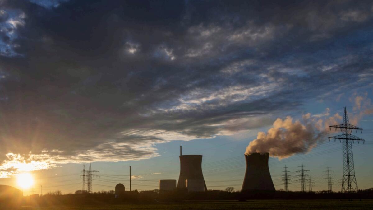 Steam rises from the cooling tower of the nuclear power plant of Gundremmingen, Bavaria. — AP