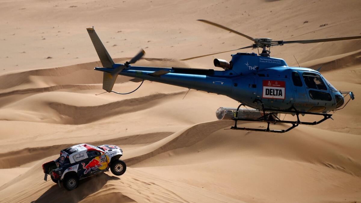Toyota's driver Nasser Al Attiyah and his co-driver Mathieu Baumel compete in the Dakar Rally. (AFP)