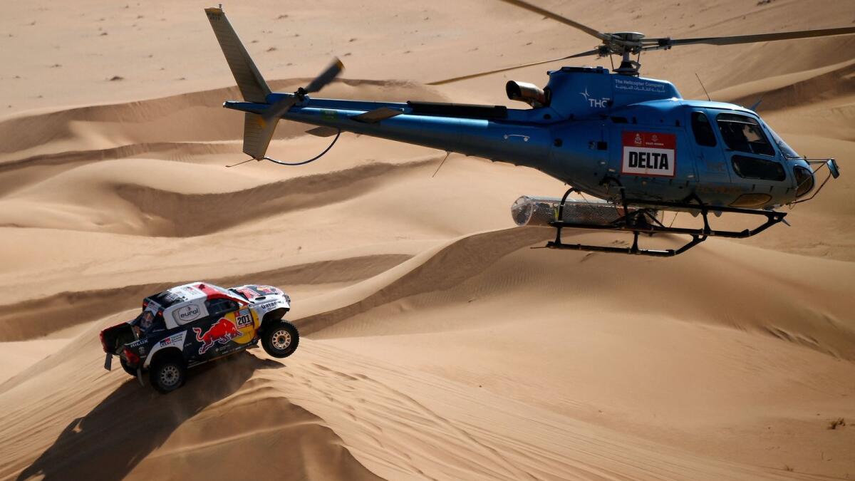 Toyota's driver Nasser Al Attiyah and his co-driver Mathieu Baumel compete in the Dakar Rally. (AFP)