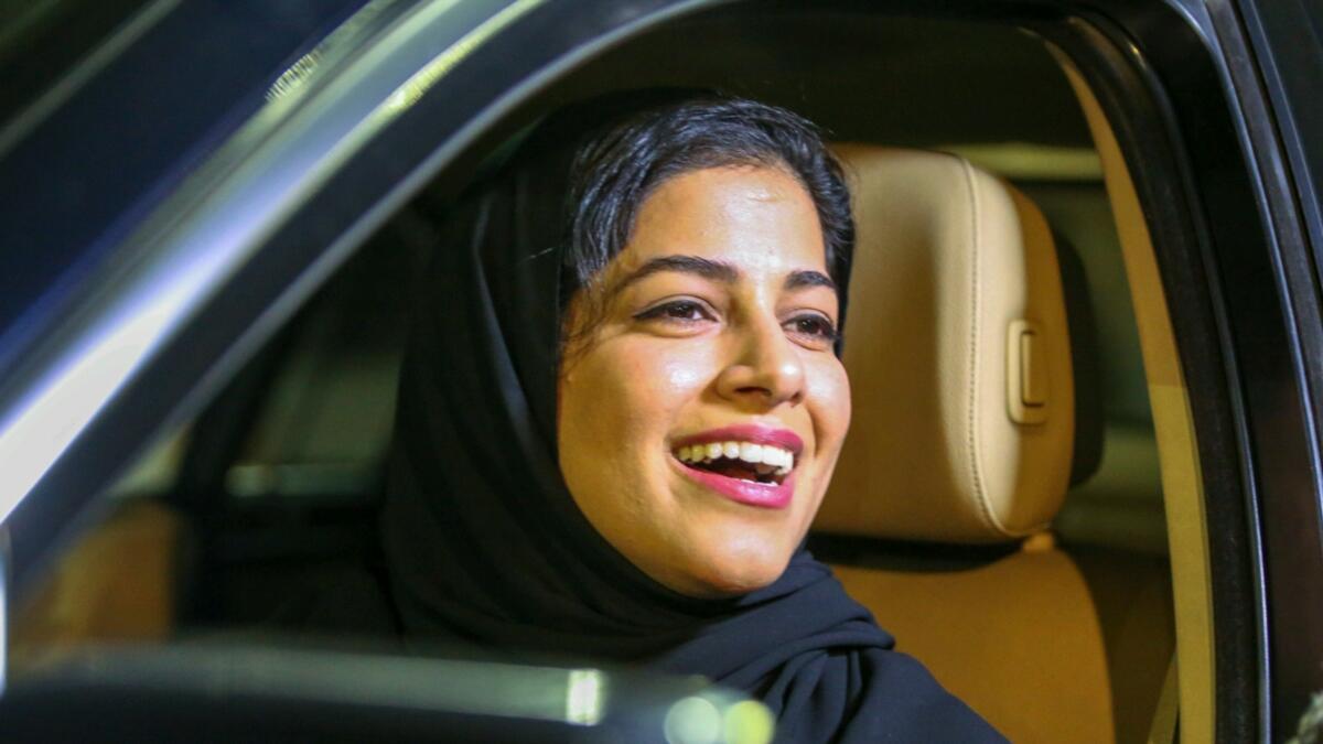 Red, orange, green... Saudi women take the wheel as driving ban lifted 