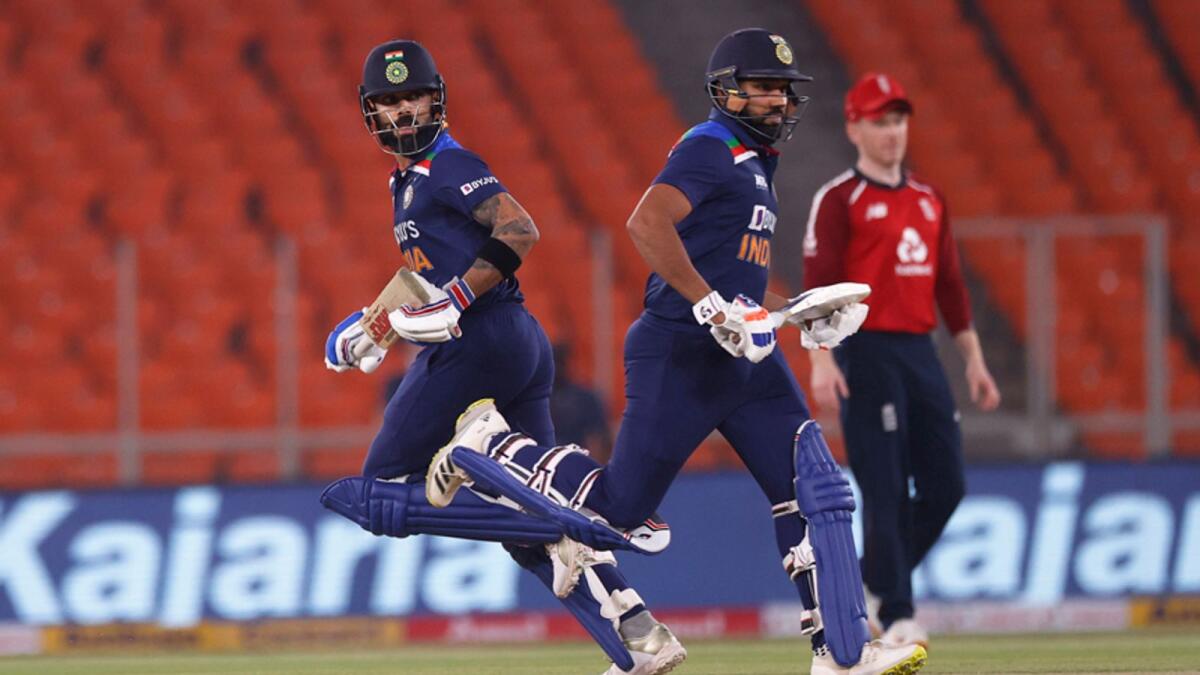 Virat Kohli (left) joined deputy Rohit Sharma at the top in Saturday’s decider. Their 94-run opening stand helped India amass 224-2, their highest total against England. — Reuters