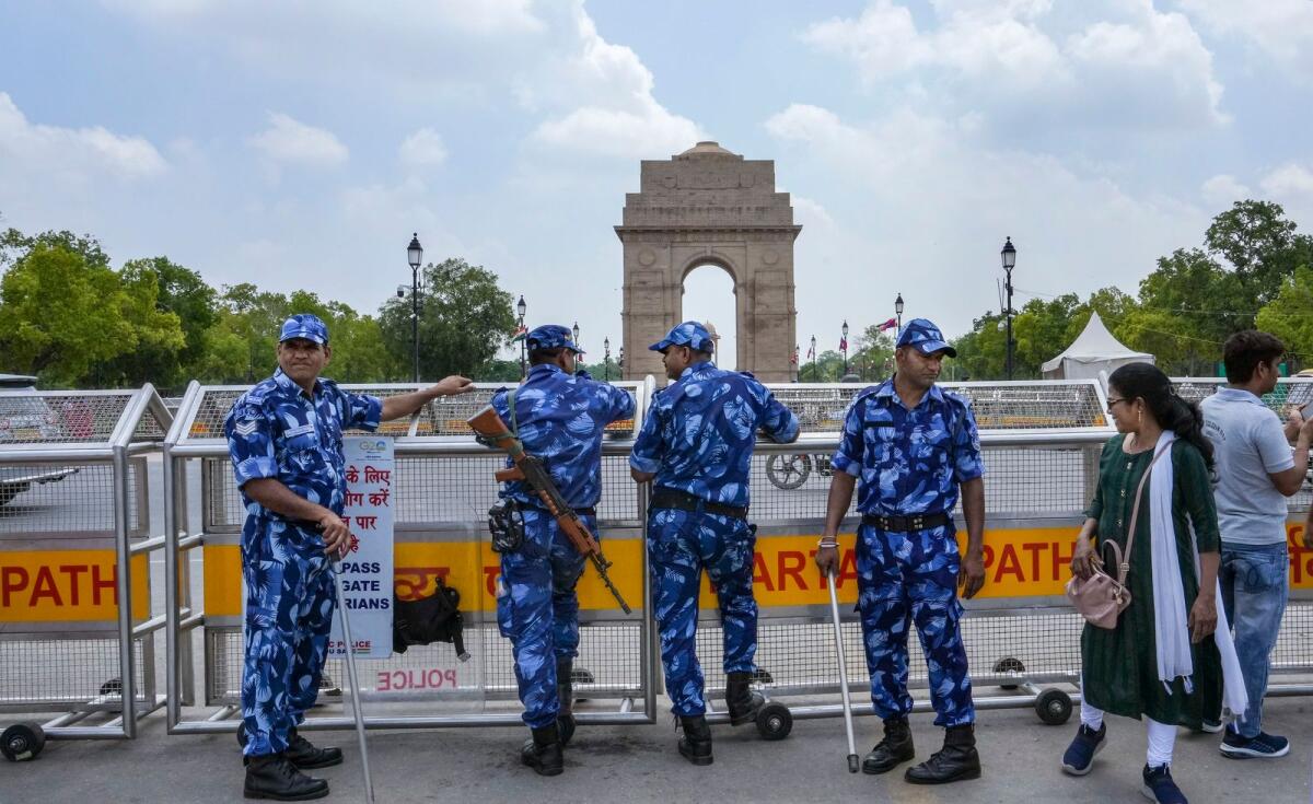 Rapid Action Force personnel stand guard near the India Gate ahead of a hunger strike called by the protesting wrestlers against WFI chief Brij Bhushan Sharan Singh in New Delhi on Wednesday. Photo: PTI