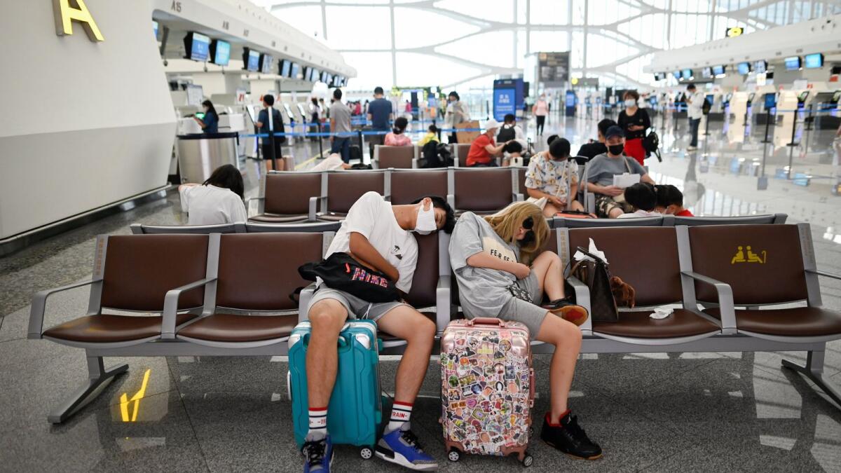 FILE IMAGE. Passengers wait for their flights at Beijing's Daxing International Airport. (Photo: AFP)