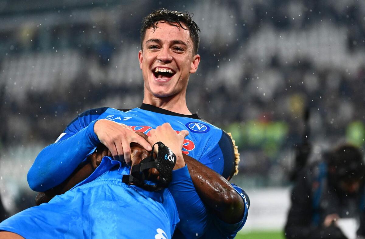 Napoli forward Giacomo Raspadori celebrates after winning the match. — AFP