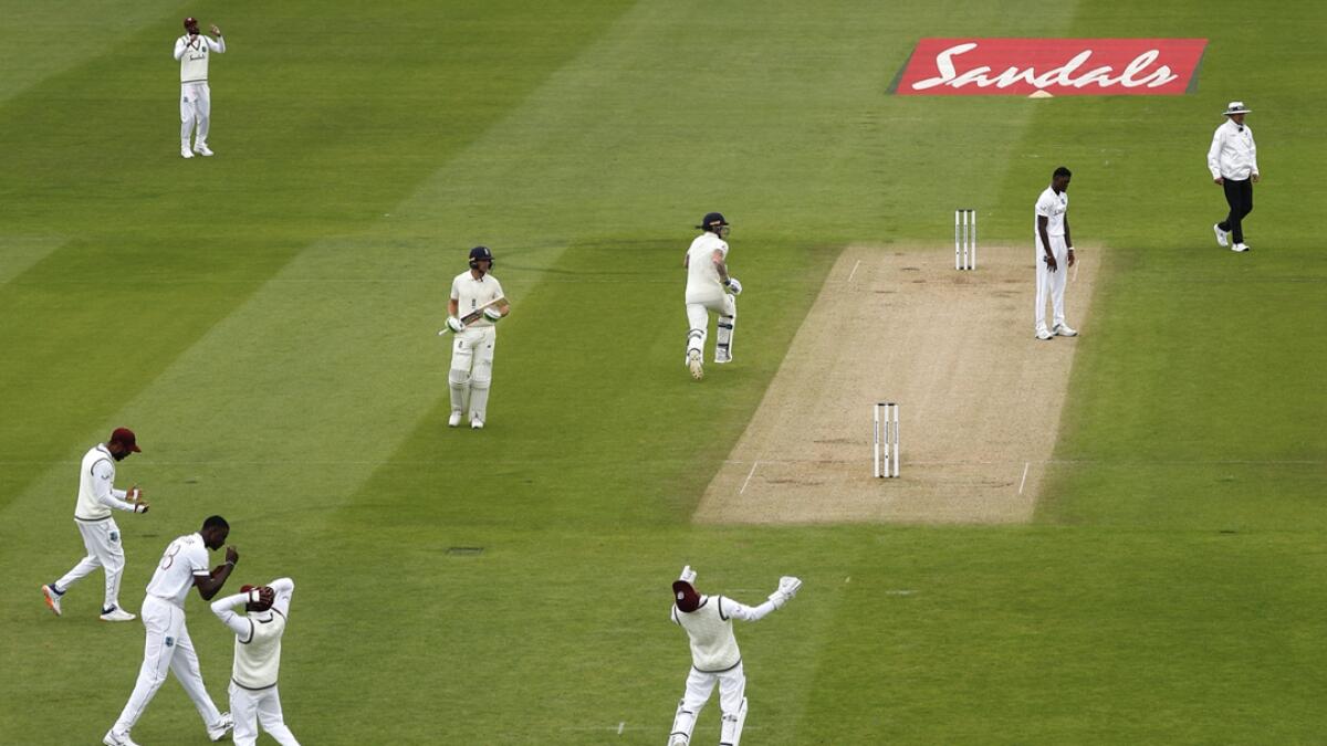 West Indies' players react after a teammate dropped a catch of England's captain Ben Stokes, third right, during the second day of the first cricket Test match between England and West Indies, at the Ageas Bowl in Southampton, England. Photo: AP