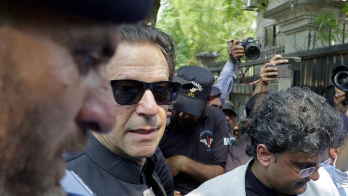 Imran Khan arrives in a court for a case hearing in Islamabad. — AFP