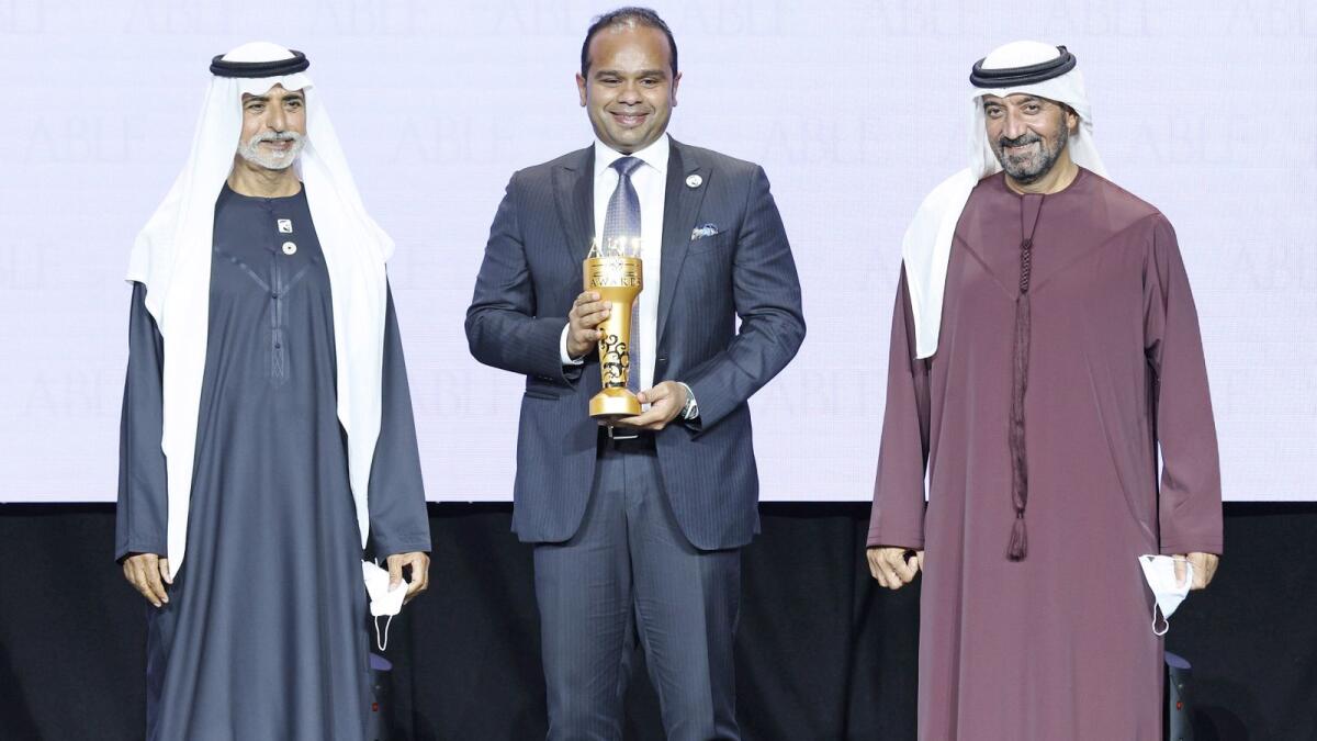 Adeeb Ahamed, managing director, LuLu Financial Holdings, receiving the ABLF Outstanding Business Achiever Award at an event on Tuesday. — Supplied photo