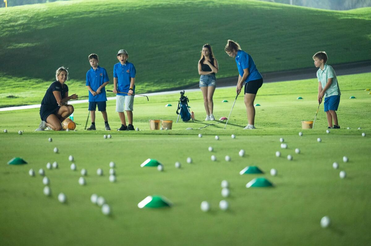 Kids practise in the golf clinic as part of the Heroes of Hope programme. — Photo by Shihab